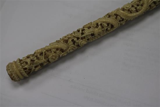 A Chinese ivory carved card case and two parasol handles
